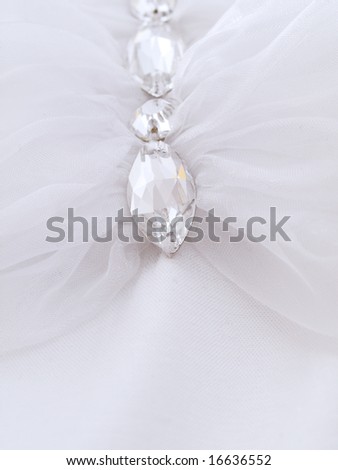 Wedding details. part of dress with jewelry