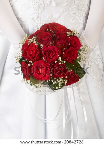 stock photo red wedding bouquet at bride's hands