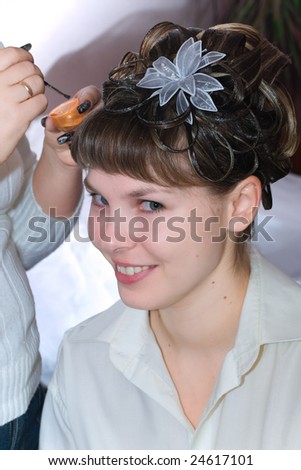 portrait of bride making evening woman coiffure