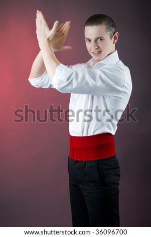 young passionate man clapping his hands