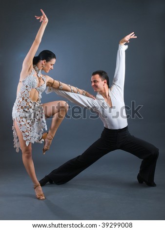 passion latin dancers over grey background
