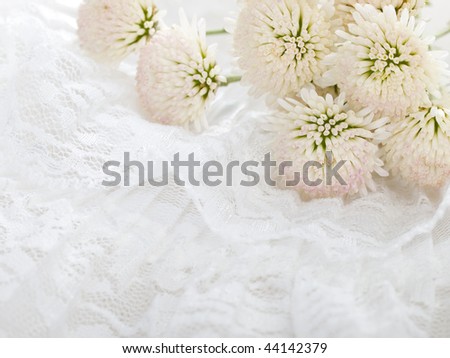 white flowers on embroidery background