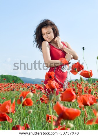 young sensual girl in poppies field
