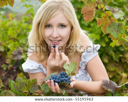 beautiful blonde girl in fall vineyard