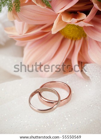 stock photo Closeup of wedding rings and flowers