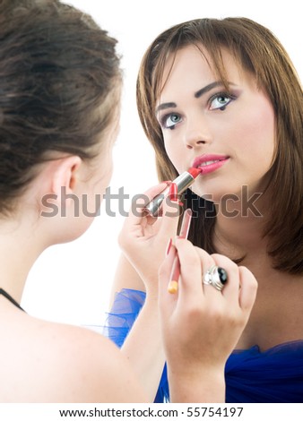 professional visage artist applying makeup to a model