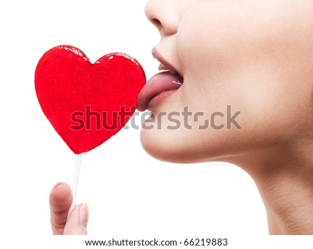 http://image.shutterstock.com/display_pic_with_logo/60418/60418,1291101512,1/stock-photo-closeup-swhite-66219883.jhot-of-girl-with-red-heart-lollipop-isolated-on-pg