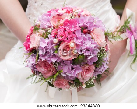 round wedding bouquet of pink flowers