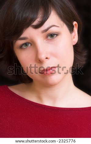 Lovely woman potrait on black background, color