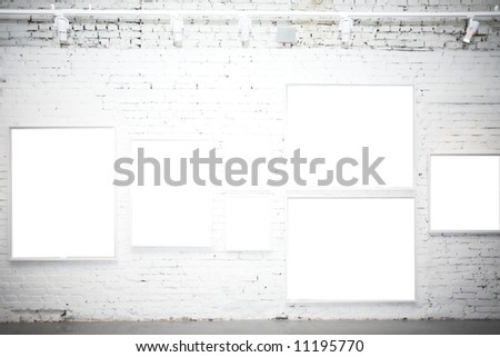 brick wall in museum with empty frames