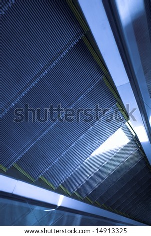 Blue move escalator in modern office centre