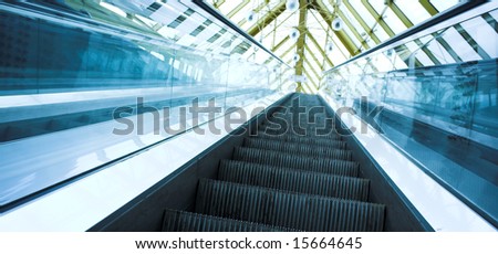 Blue move escalator in modern office centre