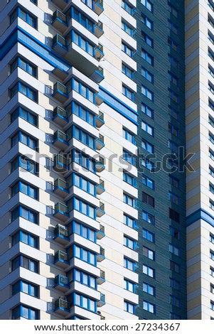 Abstract crop of blue skyscraper with balconys