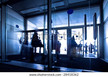 Doors in office center, crowd departure