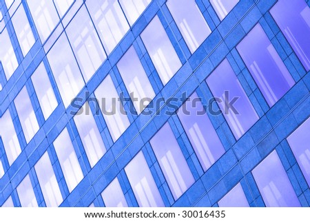 Abstract violet crop of modern office skyscraper