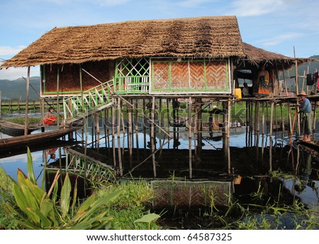 MYANMAR-OCTOBER-13: Wooden stilt houses simple life in lake on October 13, 2010  Inle lake Myanmar. Inle lake the favorite attractions for tourists who like the traditional view of life.