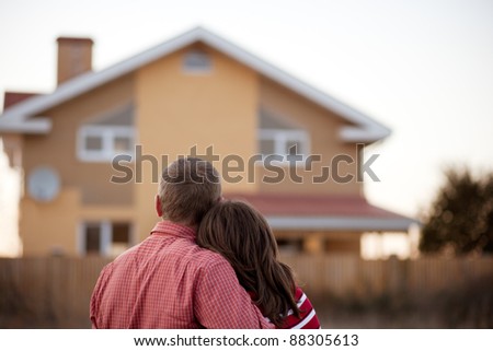 young couple near his house