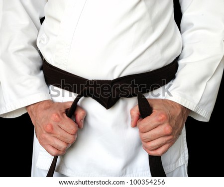 Man in a kimono and belt for martial arts
