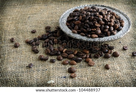 Coffee beans in a silver dish of Arabic