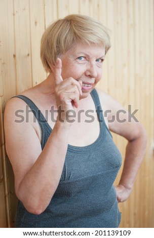 Funny elderly woman threatens you finger