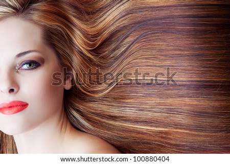 beautiful woman with artistic makeup and long brown shiny hair background