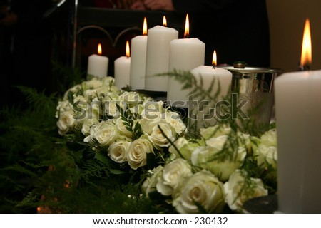 White roses and candle arrangement