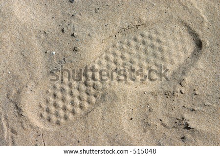 human footprint in the sand