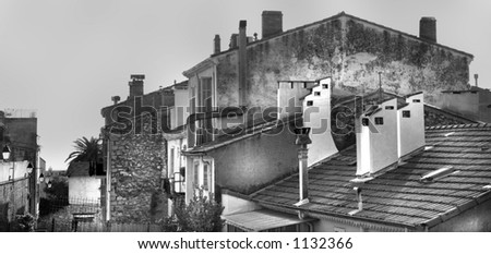 old houses and lamps on the street in Cannes, France - black and white