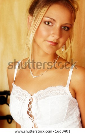 bride with green eyes in lace corset - golden glow