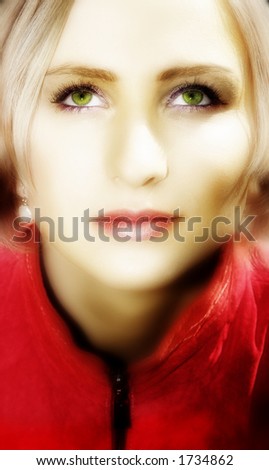 Blond angelic woman with short hair in red leather jacket and pearls