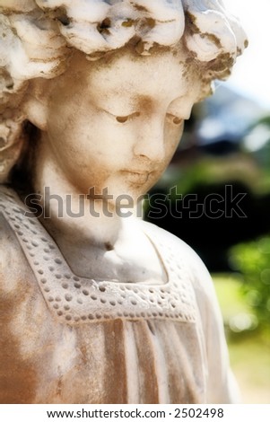Angel figure with soft child-like face marking a grave in Muizenberg South Africa