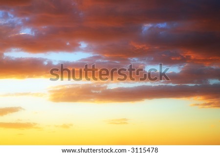 Abstract sky shot with dark clouds and golden glow