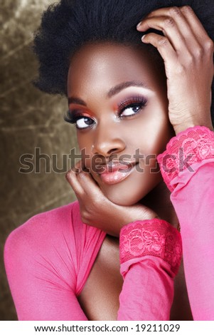 pinks makeup. African woman in pink top