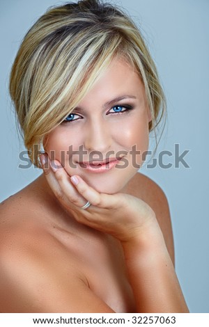 stock photo : beautiful blond woman with blue eyes and smoky make-up on eyes