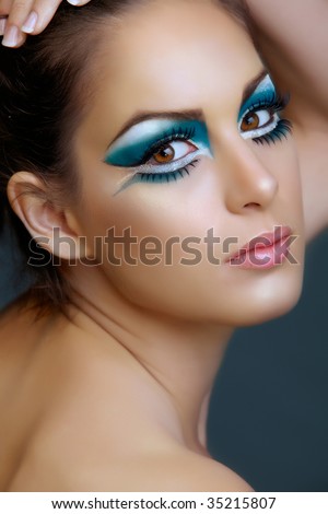  Eyes Makeup on Beautiful Brunette Woman With Cat Eyes Make Up In Turquoise And White