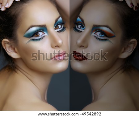 Beautiful brunette woman with cat eyes make-up in turquoise and white, with a double reflection
