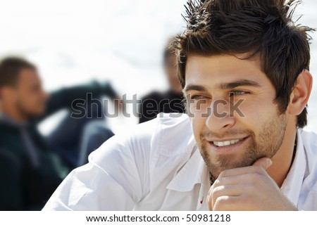 stock photo : handsome happy turkish man with mullet haircut in white shirt