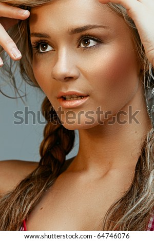 stock photo summer beauty with tanned skin and braided blond hair wearing