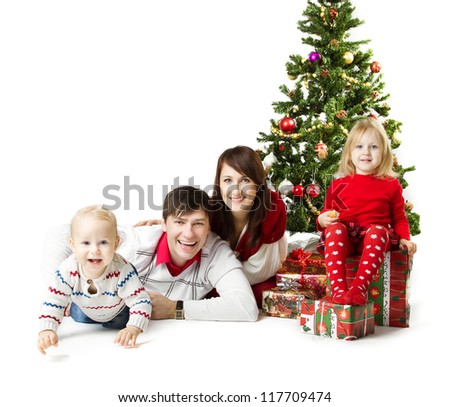 Christmas family of four persons and fir tree with gift boxes