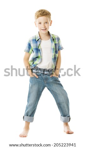 Child boy smiling fashion studio portrait, hands in pocket. Isolated white background