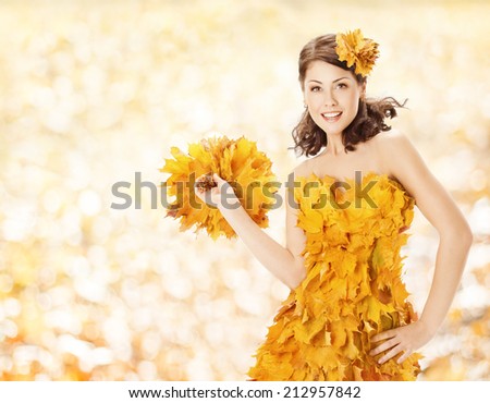 Autumn woman leaves dress, fall season fashion clothes, over yellow artistic background