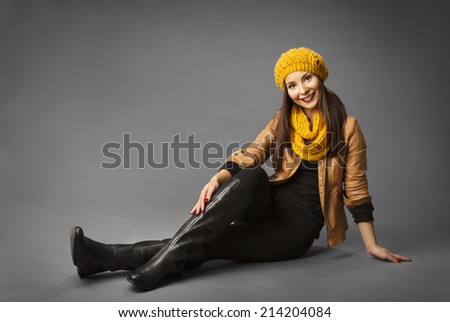 Woman Fashion Beauty Portrait, Model Girl In Autumn Season Clothing Posing in Studio, Yellow Fall Style over gray background