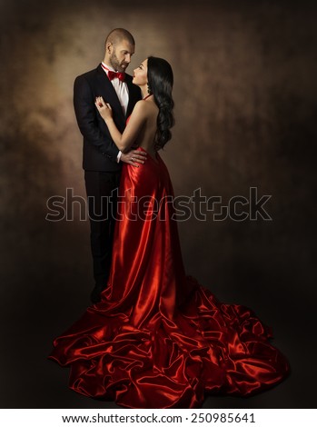 Couple in Love, Lovers Woman and Man, Glamour Classic Suit and Dress with Long Tail, Fashion Beauty Portrait of Young Models, Well Dressed in Valentine Day