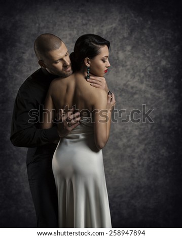 Couple Portrait, Man Woman in Love, Boy in Dark Embracing Elegant Sexy Girl in Gown with Naked Back