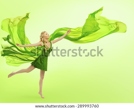 Woman in Green Dress with Blowing Cloth on Wind, Young Girl Posing Open Hands, Silk Fabric Fly over Green Background