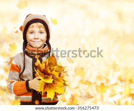 Kid Autumn Fashion Season, Child in Hat Jacket Clothing, Boy with Fall Leaves Looking at camera, six years old