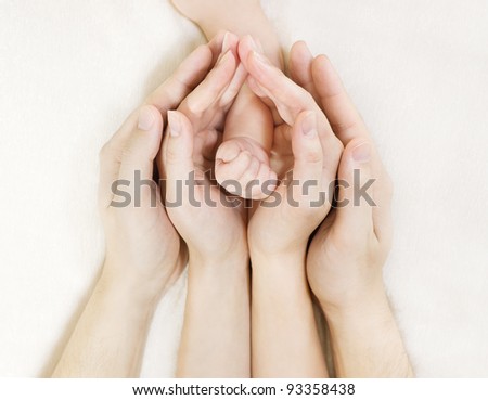 Family and newborn baby hand, mother and father helping new born kid