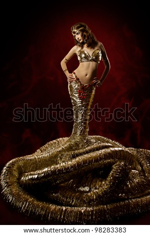 Woman snake in fantasy dress. Snake fashion dress stylish. Abstract background. Artwork