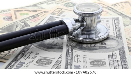 Stethoscope on Money Dollar Cash Currency Banknote Background Using for Healthy Financial and Insurance Concept