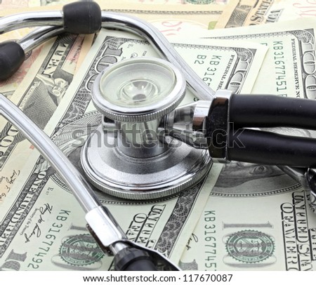 Stethoscope on Money Dollar Cash Currency Banknote Background Using for Healthy Financial and Insurance Concept